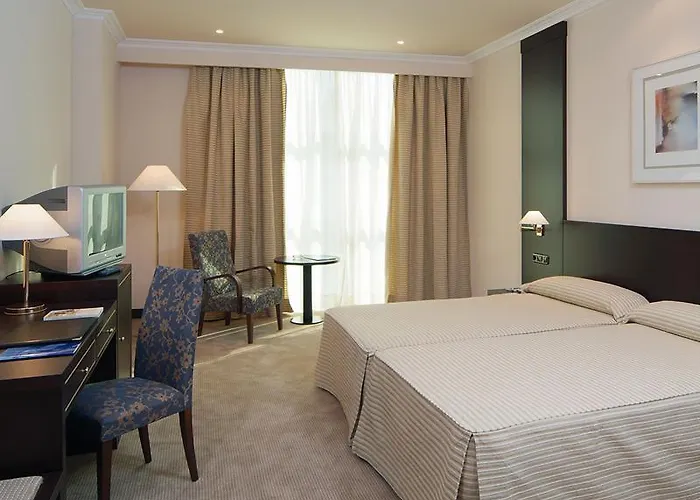 Exe Centro 4* Ов'єдо